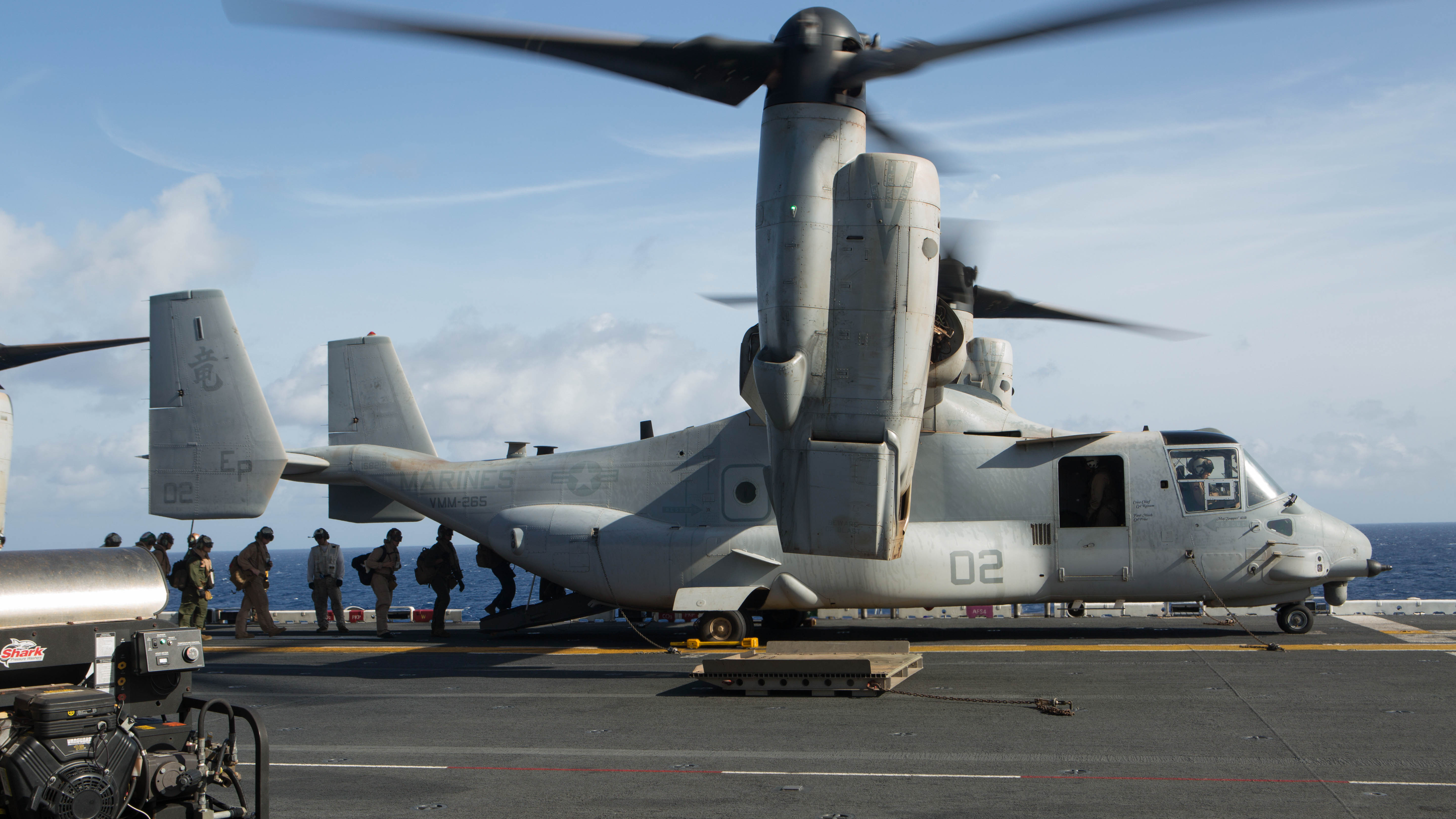 U.S. Marines and sailors with the 31st Marine Expeditionary Unit load into an MV-22B Osprey aboard the USS Bonhomme Richard (LHD 6), Aug. 8, 2015. The 31st MEU is staging Ospreys in Guam in support of typhoon recovery efforts in Saipan. The aircraft will be on standby in the event their aerial lift capacity is needed to distribute emergency supplies to remote areas. Saipan, the most populated island in the Commonwealth of the Northern Mariana Islands, was struck by Typhoon Soudelor Aug. 2-3.  (U.S. Marine Corps photo by Cpl. Tyler Ngiraswei/ Released)